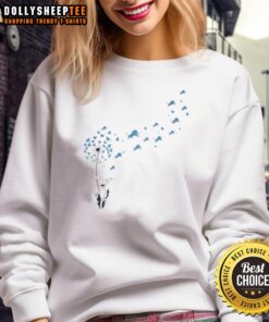 Alt Text: Top view of a dandelion flower with the Detroit Lions football logo on a stylish sweatshirt.