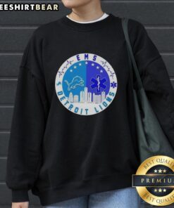 Alt Text: Top Detroit Lions Heartbeat EMS city skyline sweatshirt featuring vibrant design and team colors.