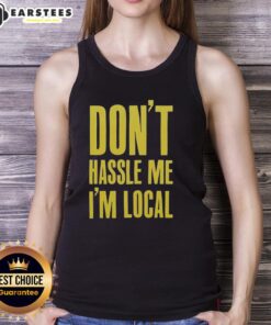 Stylish 'Don't Hassle Me I'm Local' tank top displayed on a hanger, perfect for summer outings and casual wear.