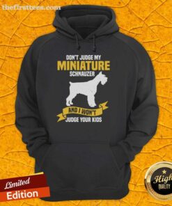 Alt Text: Cozy hoodie featuring a humorous quote about miniature schnauzers and kids, perfect for dog lovers and parents.