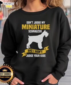 Cozy 'Don't Judge My Miniature Schnauzer' sweatshirt featuring a playful design, perfect for dog lovers and casual outings.