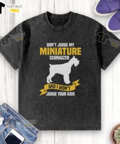 Funny washed t-shirt design featuring a miniature Schnauzer with the phrase about not judging kids, perfect for dog lovers.