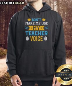 Cozy 'Don't Make Me Use My Teacher Voice' hoodie featuring a playful design perfect for educators and teaching enthusiasts.