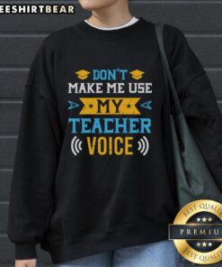 Cozy 'Don't Make Me Use My Teacher Voice' sweatshirt in a casual setting, perfect for educators and teaching enthusiasts.