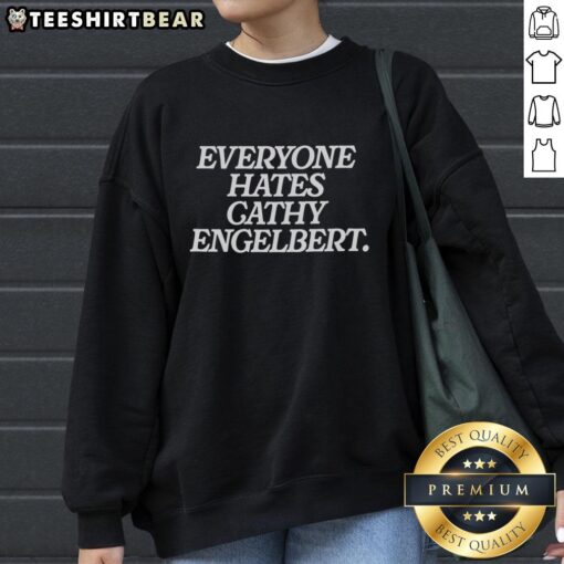 Cathy Engelbert sweatshirt with 'Everyone Hates Cathy' graphic, showcasing bold design and casual style.