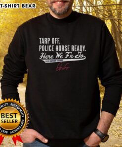 Alt Text: George Springer celebrates Toronto Blue Jays 2025 Division Champs in a sweatshirt with police horse nearby.