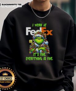 Alt Text: Top Grinch Christmas Tree sweatshirt featuring 'I Work At It's Fine, Everything Is Fine' design for festive cheer.