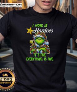Alt Text: Top Grinch Christmas Tree X Hardee's T-Shirt featuring 'I Work At Its Fine Everything Is Fine' slogan.