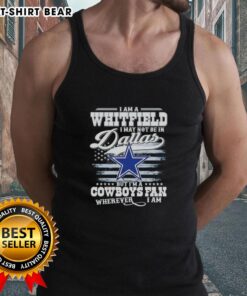Person wearing 'I May Not Be in Dallas But I'm a Cowboys Fan Wherever I Am' tank top, showcasing team spirit.