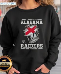 Cozy 'I May Live In Alabama But I'm A Raiders Fan Forever' sweatshirt in black, perfect for NFL fans and casual wear.
