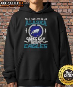 Alt Text: Philadelphia Eagles hoodie worn in Alaska, showcasing team spirit on game day with vibrant colors and logo.