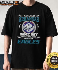 Alt Text: Game day t-shirt featuring 'I May Live In Arkansas But My Heart Belongs To Philadelphia Eagles' design.