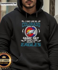 Cozy hoodie featuring 'I May Live In Colorado But On Game Day My Heart Belongs To Philadelphia Eagles' design.