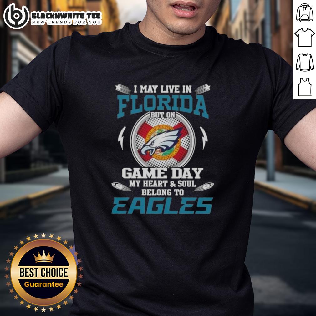 Top I May Live In Florida But On Game Day My Heart And Soul Belongs To Philadelphia Eagles T-Shirt Alt Text: Florida resident wearing a Philadelphia Eagles t-shirt on game day, showcasing team pride and spirit.