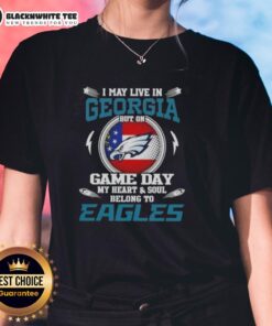 Philadelphia Eagles ladies tee design: 'I may live in Georgia, but my heart belongs to the Eagles' for game day spirit.