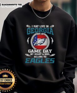 Alt Text: Georgia resident wearing Philadelphia Eagles sweatshirt on game day, showcasing team spirit and pride.