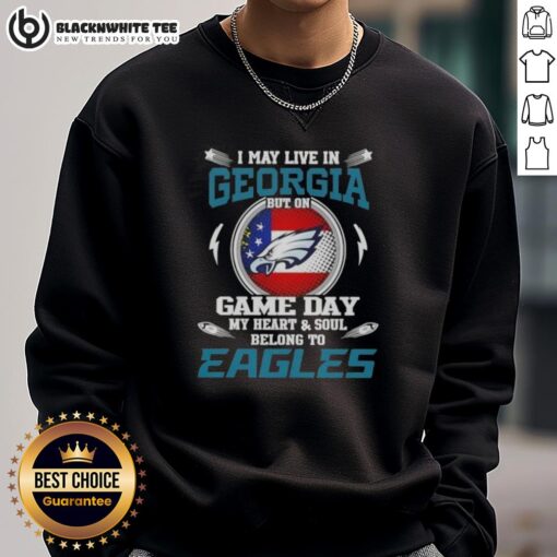 Alt Text: Georgia resident wearing Philadelphia Eagles sweatshirt on game day, showcasing team spirit and pride.