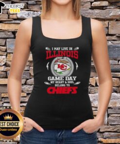 Illinois fan wearing a Kansas City Chiefs tank top, showcasing team spirit on game day with vibrant colors and logo.