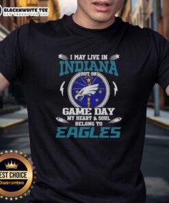 Alt Text: Top I May Live In Indiana But On Game Day My Heart And Soul Belongs To Philadelphia Eagles T-Shirt design