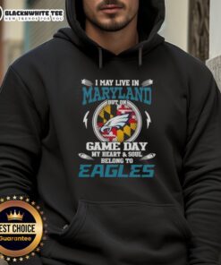 Person wearing Philadelphia Eagles hoodie, showcasing pride for the team while living in Maryland on game day.