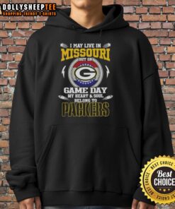 Fan wearing Green Bay Packers hoodie, showcasing pride with text: 'I may live in Missouri, but my heart belongs to Packers.'