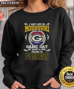 Cozy sweatshirt featuring 'I May Live In Missouri But On Game Day My Heart Belongs To Green Bay Packers' design.