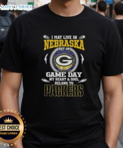 Game day t-shirt featuring 'I May Live In Nebraska But My Heart Belongs To Green Bay Packers' design.
