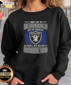 Cozy sweatshirt with 'I May Live In Nebraska But On Gameday My Heart And Soul Belongs To Raiders' slogan.