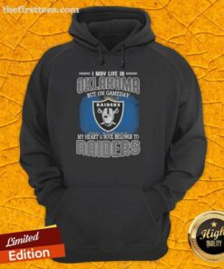 Oklahoma fan wearing a Raiders hoodie on game day, showcasing team spirit and pride for the Raiders.
