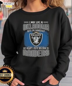 Cozy sweatshirt featuring 'I May Live In Oklahoma But On Gameday My Heart Belongs To Raiders' for fans showing team spirit.