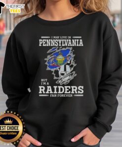 Cozy sweatshirt with 'I May Live in Pennsylvania But I'm a Raiders Fan Forever' design, perfect for loyal Raiders fans.