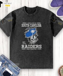 South Carolina Raiders fan washed t-shirt, showcasing pride with 'I may live in South Carolina, but Im a Raiders fan forever.'