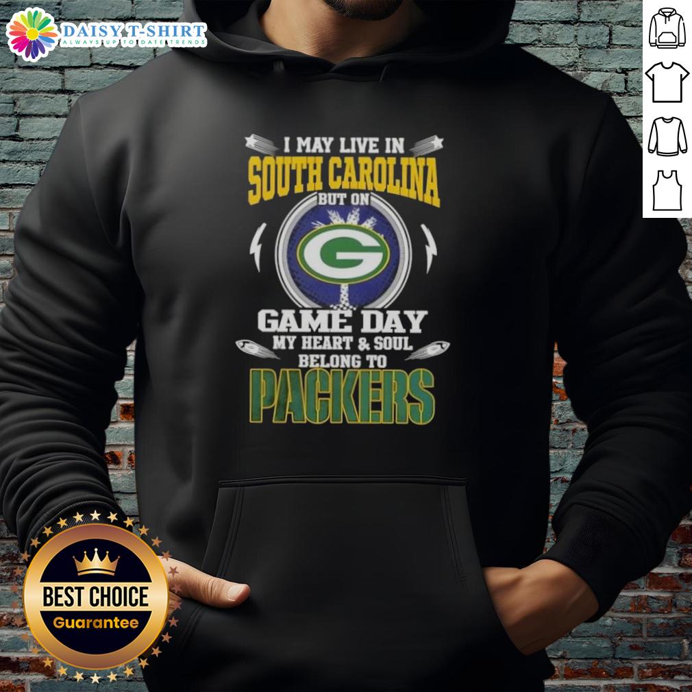 Top I May Live In South Carolina But On Game Day My Heart And Soul Belongs To Green Bay Packers Hoodie Green Bay Packers hoodie with 'I May Live In South Carolina' print, perfect for game day fans showing team pride.