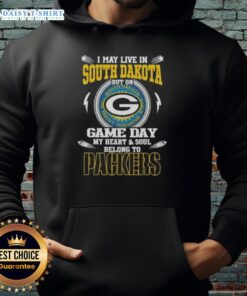 Green Bay Packers hoodie with text 'I May Live In South Dakota But On Game Day My Heart Belongs To Packers' displayed.