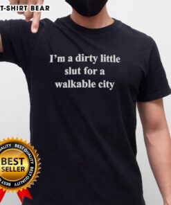 Alt Text: Top I'M A Dirty Lil Slut For A Walkable City Classic T-Shirt featuring bold text design on a stylish backdrop.
