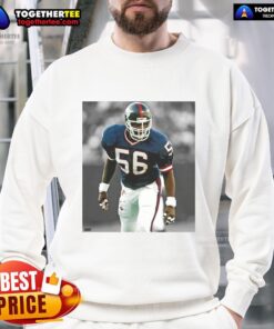 Top Lawrence Taylor New York Giants football sweatshirt featuring team colors and iconic player graphics.