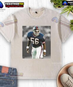 Alt Text: Top Lawrence Taylor New York Giants football washed t-shirt, showcasing vintage design and team spirit.