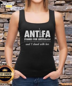 Top featuring the Statue of Liberty, Antifa symbol, and 'I Stand With Her' message promoting antifascist values.
