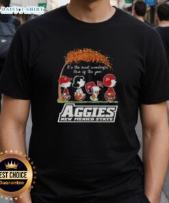 Alt Text: Top Peanuts Snoopy and Friends holiday t-shirt featuring 'It's The Most Wonderful Time Of The Year' for Aggies New Mexico State.