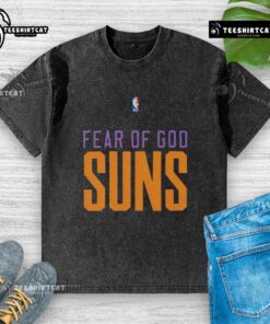 Alt Text: Top Phoenix Suns NBA Fear of God Washed T-Shirt featuring bold logo and stylish design for fans.