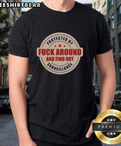 Top Protected By Surveillance 'Fck Around And Find Out' T-Shirt showcasing a bold graphic design for edgy fashion enthusiasts.
