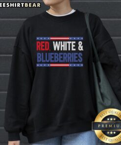 Stylish top featuring red, white, and blue blueberries design on a cozy sweatshirt, perfect for casual wear.