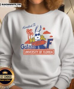 Alt Text: Top Snoopy X Florida Gators sweatshirt featuring iconic Snoopy design for University of Florida fans.