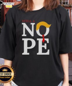 Womens tee featuring 'Top Still A Nope Trump Hair' graphic, perfect for political humor enthusiasts and casual wear.