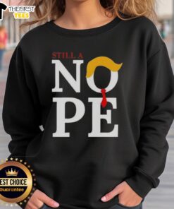 Top Still A Nope Trump Hair Sweatshirt featuring a humorous design of Trump's iconic hairstyle on a cozy sweatshirt.