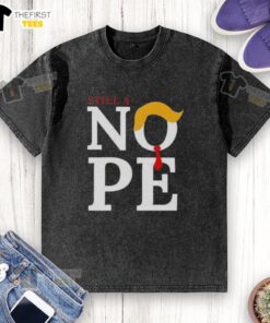 Top Still A Nope Trump Hair Washed T-Shirt featuring bold text and a humorous design for political satire fans.