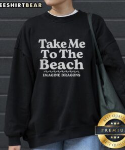 Top Take Me To The Beach Imagine Dragons sweatshirt featuring vibrant beach-themed graphics and cozy design.