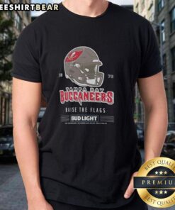 Alt Text: Vintage Tampa Bay Buccaneers Bud Light 1976 football helmet T-shirt featuring 'Raise The Flags' design.