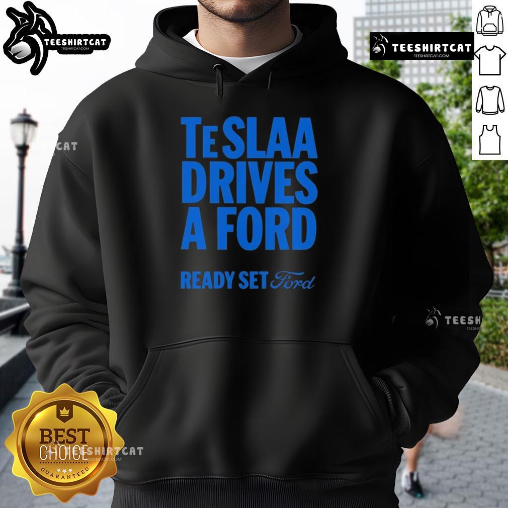 Top Teslaa Drives A Ford Ready Set Ford Hoodie Person wearing a 'Top Tesla Drives a Ford' hoodie, showcasing a fun automotive-themed graphic and stylish design.