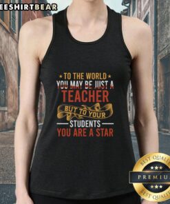 Teacher wearing 'Top To The World' tank top, celebrating their impact as a star in students' lives. Perfect for educators!